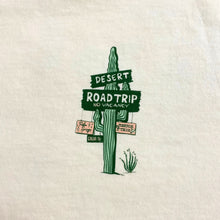 Load image into Gallery viewer, Opal Atlas desert road trip T-shirt front design with cactus sign graphic and “Desert Road Trip No Vacancy” text.

