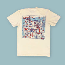 Load image into Gallery viewer, An off-white short-sleeve t-shirt with a large square graphic print on the back, featuring a detailed red, white, and blue map illustration of San Francisco landmarks and boats. The t-shirt is displayed flat against a solid light blue background.
